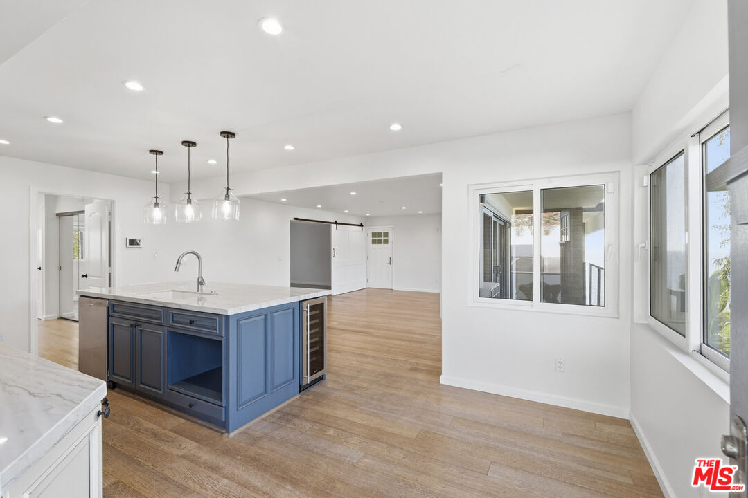 2442 South Coast Highway, Unit 4 Laguna Beach, CA 92651 - Photo 10 of 22 a spacious bathroom with a double vanity sink and a mirror