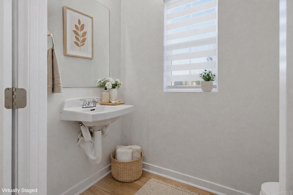 35131 Rangpur Lane Fallbrook, CA 92028 - Photo 11 of 61 a bathroom with a sink toilet and a window