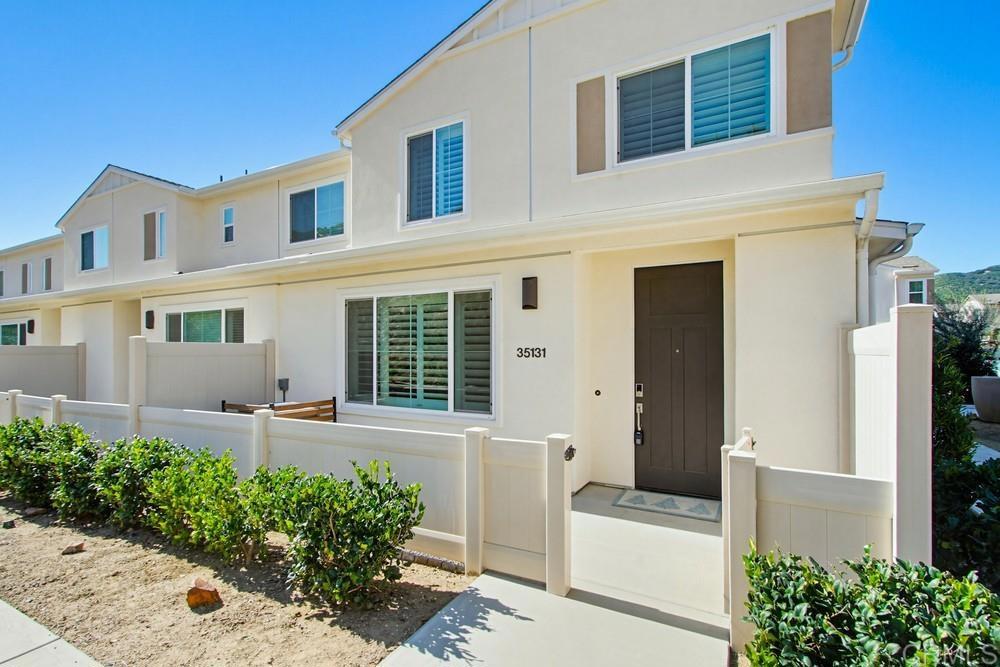 35131 Rangpur Lane Fallbrook, CA 92028 - Photo 3 of 61 a front view of a house with a yard