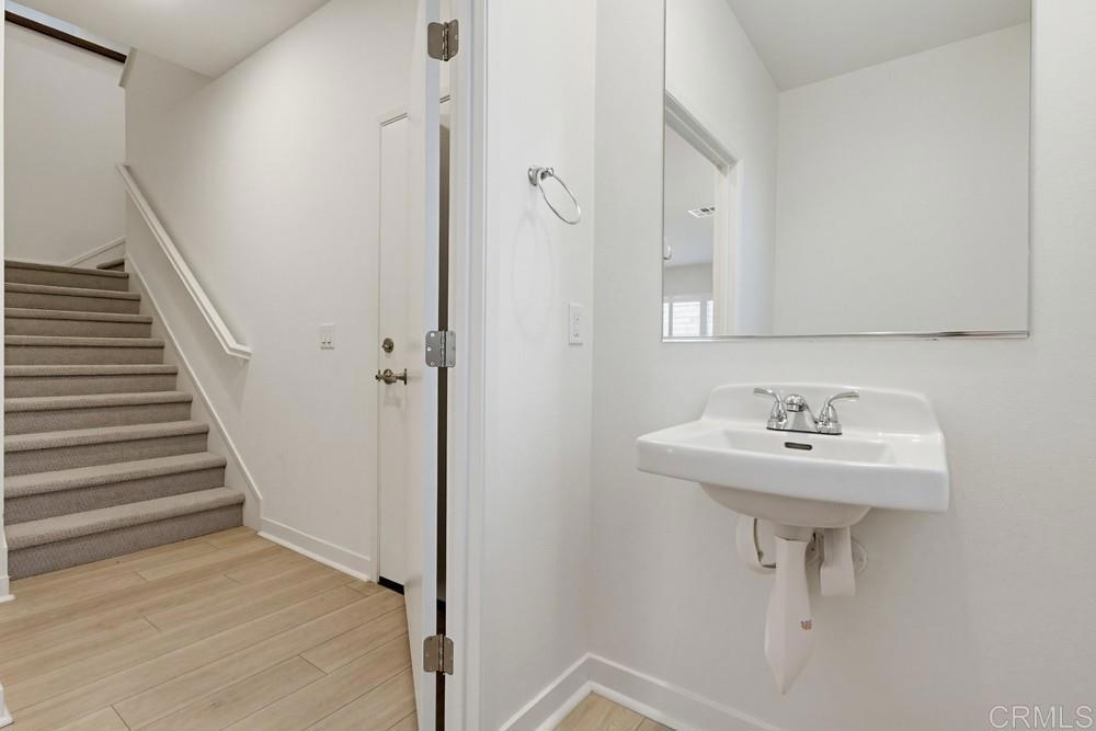 35131 Rangpur Lane Fallbrook, CA 92028 - Photo 33 of 61 a bathroom with a sink a mirror and a shower