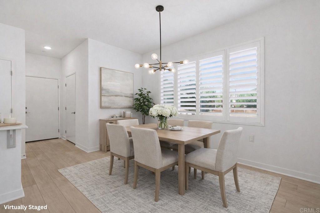 35131 Rangpur Lane Fallbrook, CA 92028 - Photo 8 of 61 a view of a dining room with furniture window and wooden floor