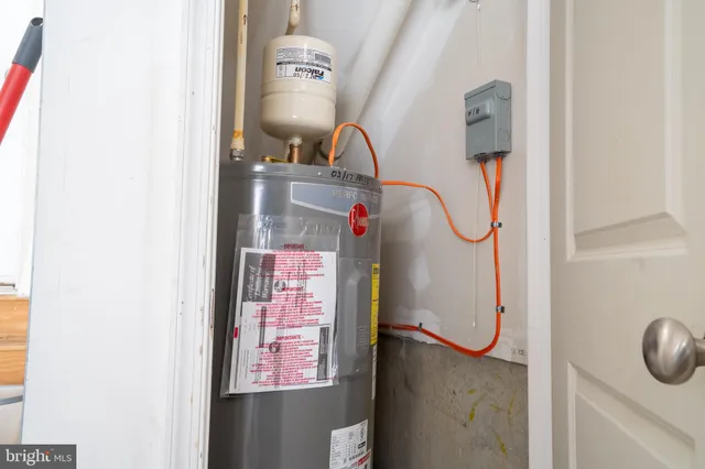 a view of a blue house with many windows