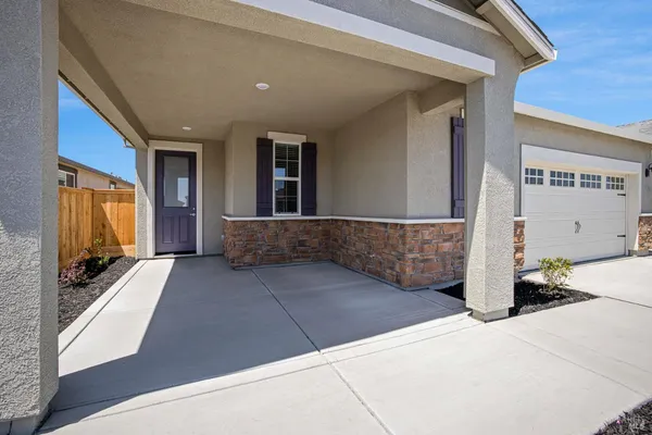 a view of a house with entryway doors