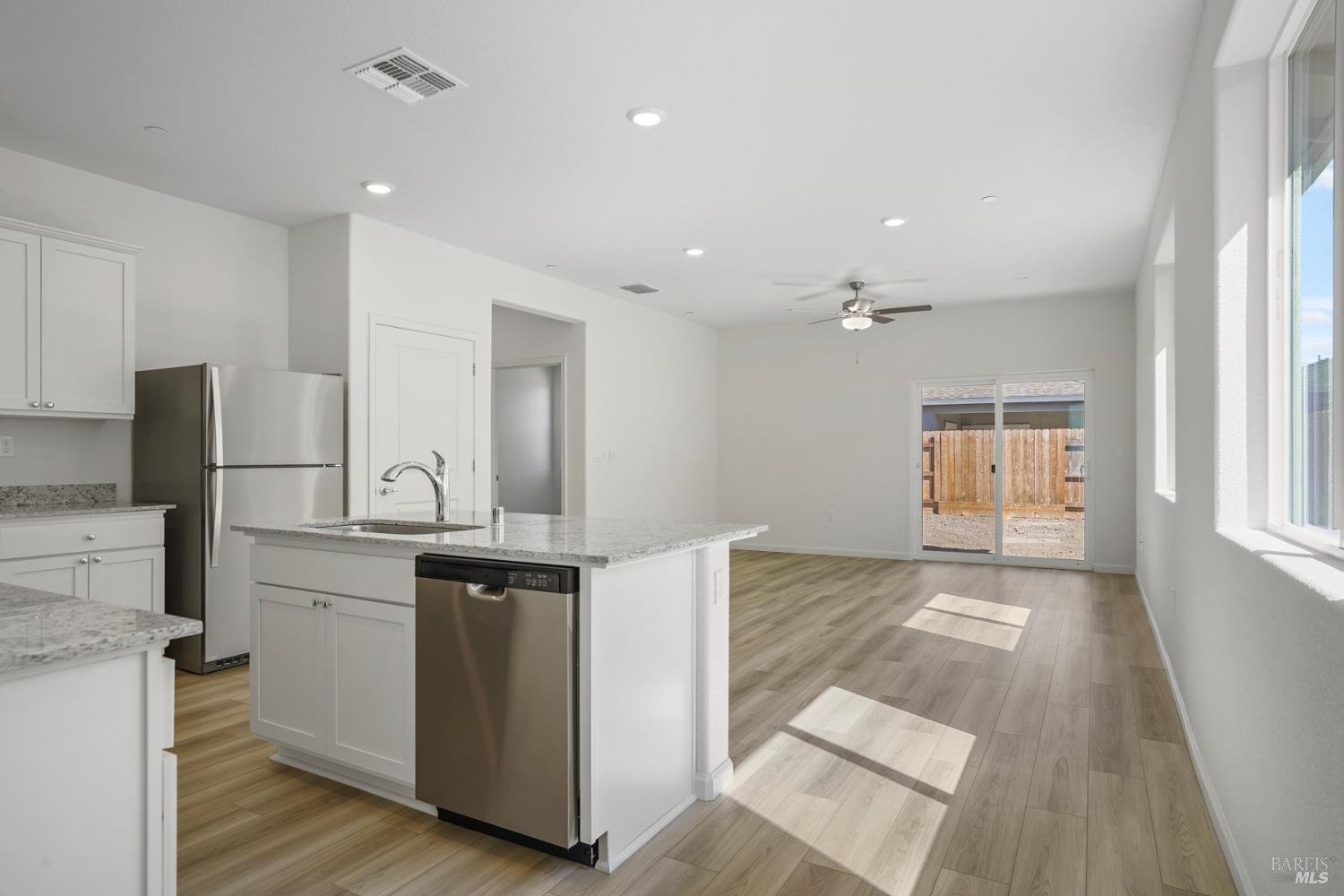 2241 Front Porch Lane Rio Vista, CA 94571 - Photo 3 of 23 a view of kitchen with wooden floor and electronic appliances