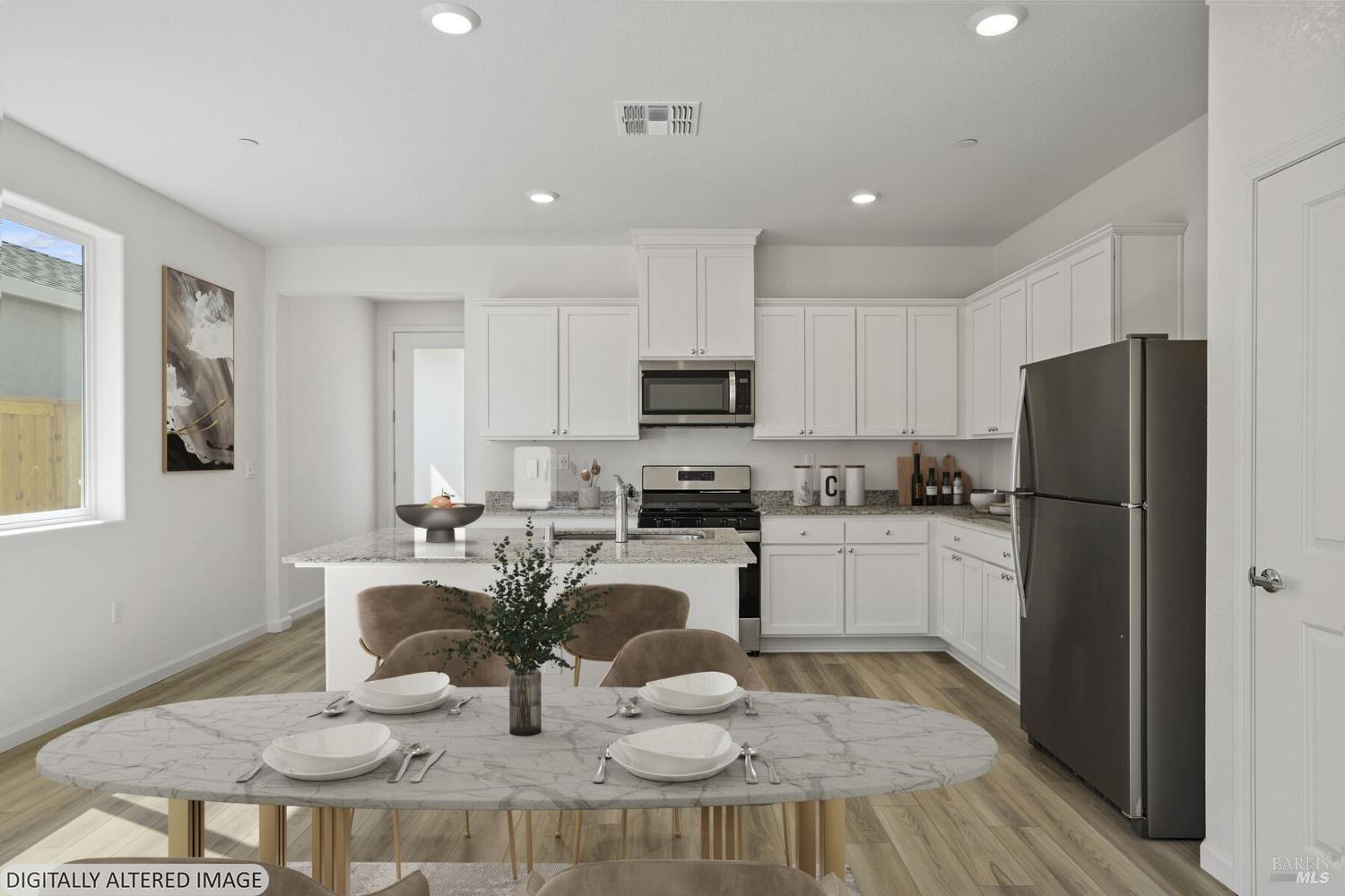2241 Front Porch Lane Rio Vista, CA 94571 - Photo 7 of 23 a kitchen with a refrigerator and a stove top oven