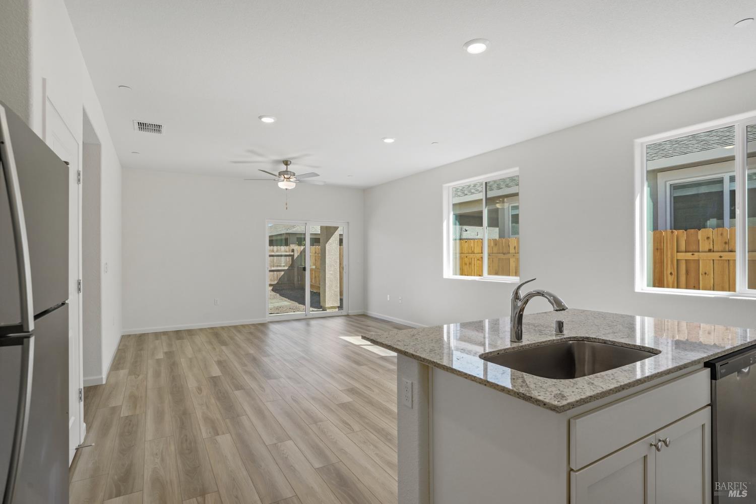 2241 Front Porch Lane Rio Vista, CA 94571 - Photo 8 of 23 a kitchen with a sink cabinets and wooden floor