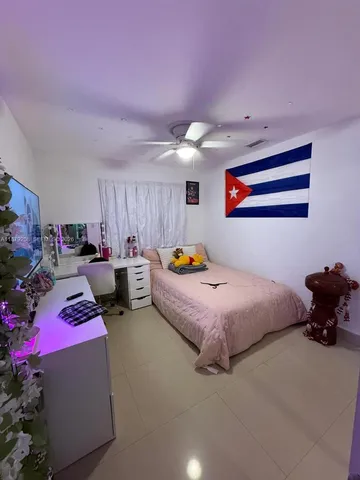 a bedroom with furniture and a bed