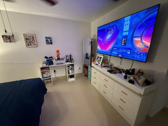 a room with a couch and a workspace