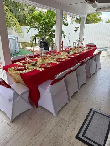 a view of swimming pool with a table and chairs
