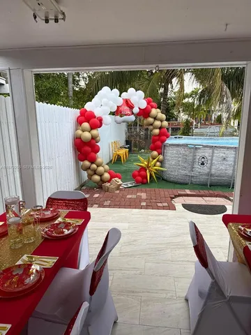 a outdoor living space with furniture and a floor to ceiling window