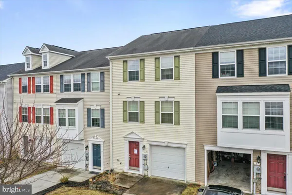 a front view of a building with a street