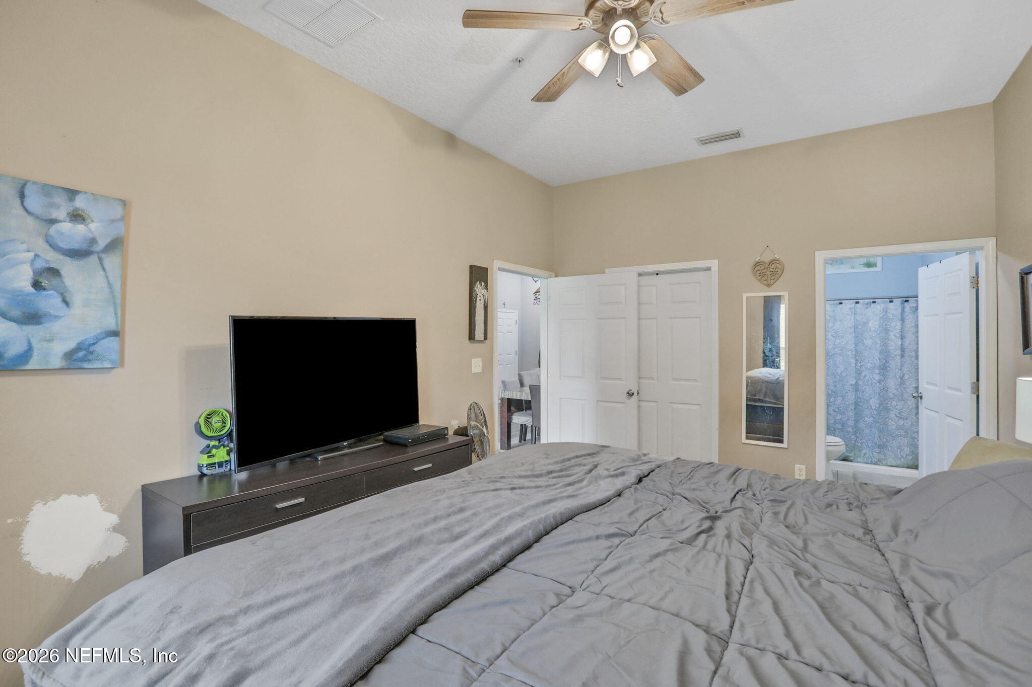 706 Golden Lake Loop St. Augustine, FL 32084 - Photo 20 of 32 a bedroom with a bed and a flat screen tv