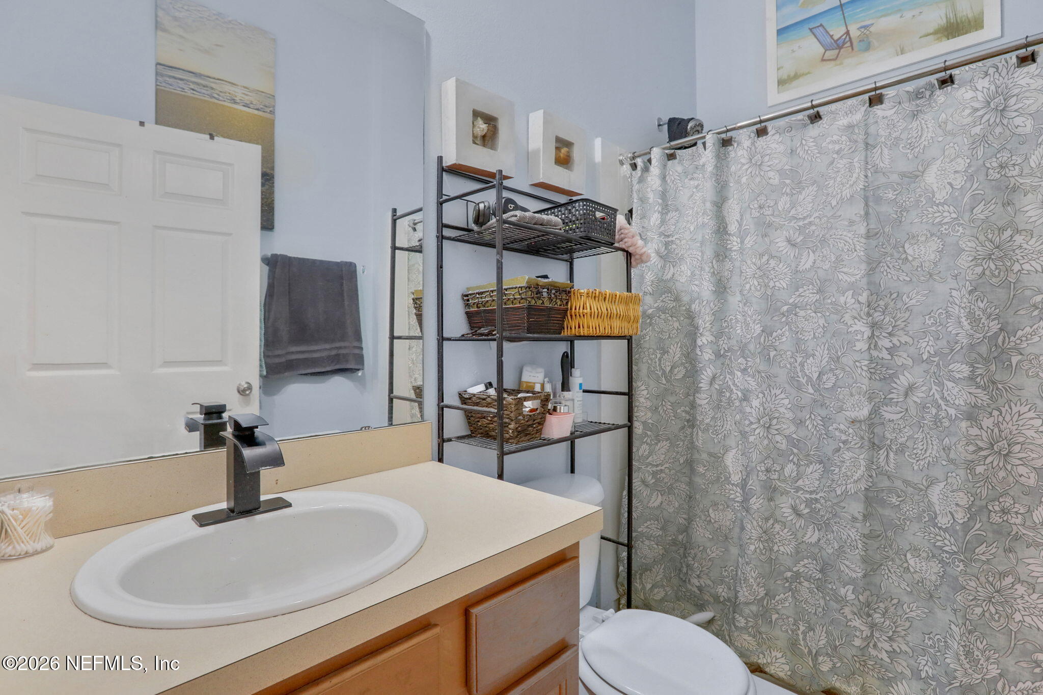 706 Golden Lake Loop St. Augustine, FL 32084 - Photo 26 of 32 a bathroom with a sink toilet and shower