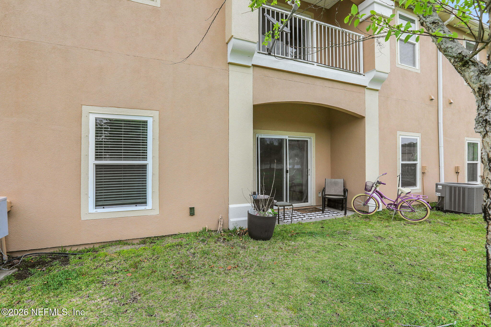 706 Golden Lake Loop St. Augustine, FL 32084 - Photo 28 of 32 a view of a house with backyard sitting area and garden