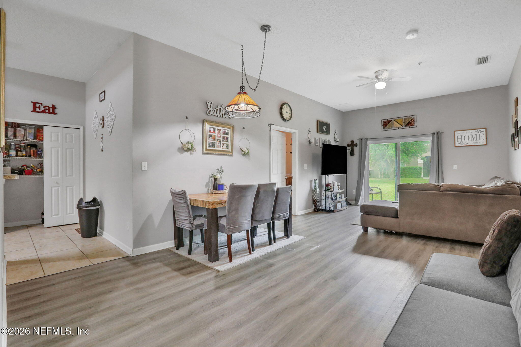 706 Golden Lake Loop St. Augustine, FL 32084 - Photo 6 of 32 a living room with furniture and a flat screen tv