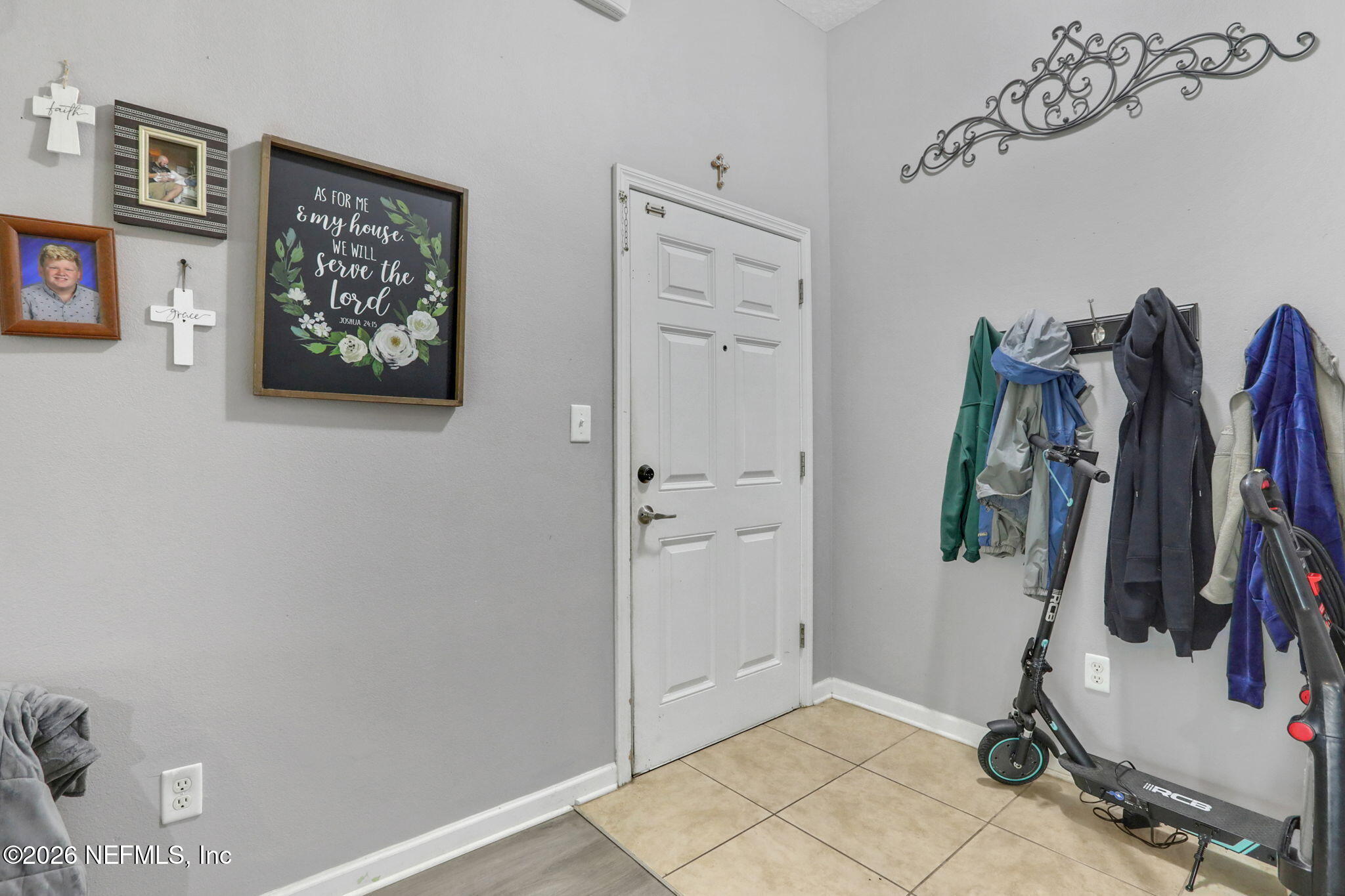 706 Golden Lake Loop St. Augustine, FL 32084 - Photo 7 of 32 a view of walk in closet with clothes and shoes