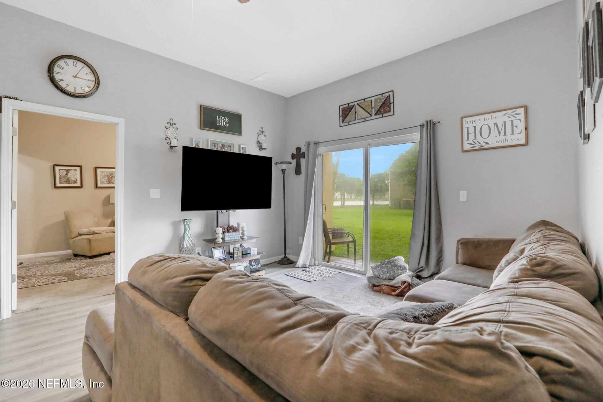 706 Golden Lake Loop St. Augustine, FL 32084 - Photo 10 of 32 a bedroom with a bed and a flat screen tv