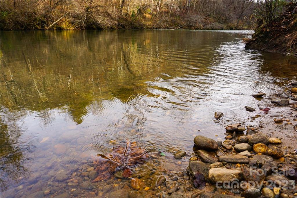 Lot 11 Destiny Dr Mill Spring, Unit LOT 11 Mill Spring, NC 28756 - Photo 19 of 28 a view of a lake with an outdoor space