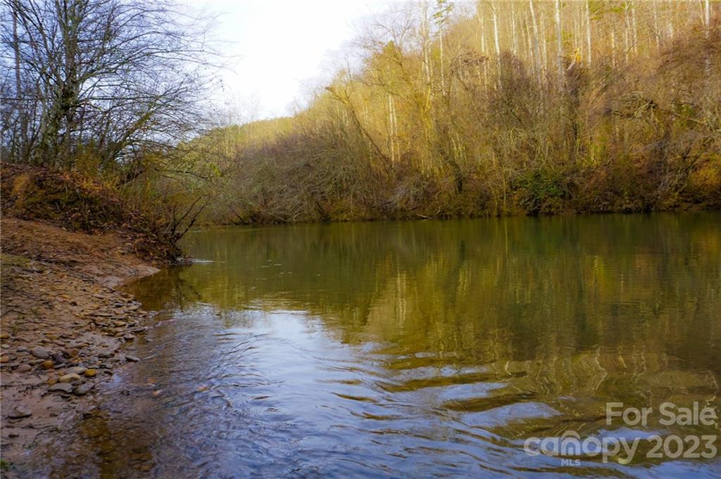Lot 11 Destiny Dr Mill Spring, Unit LOT 11 Mill Spring, NC 28756 - Photo 21 of 28 a view of a lake with a mountain
