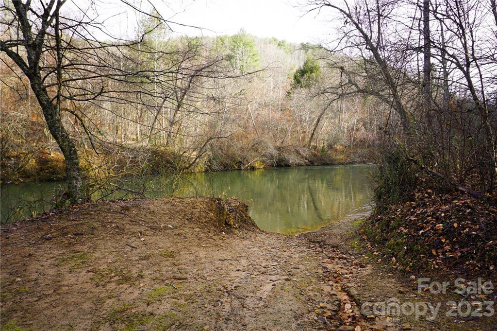 Lot 11 Destiny Dr Mill Spring, Unit LOT 11 Mill Spring, NC 28756 - Photo 28 of 28 a view of a lake with a trees