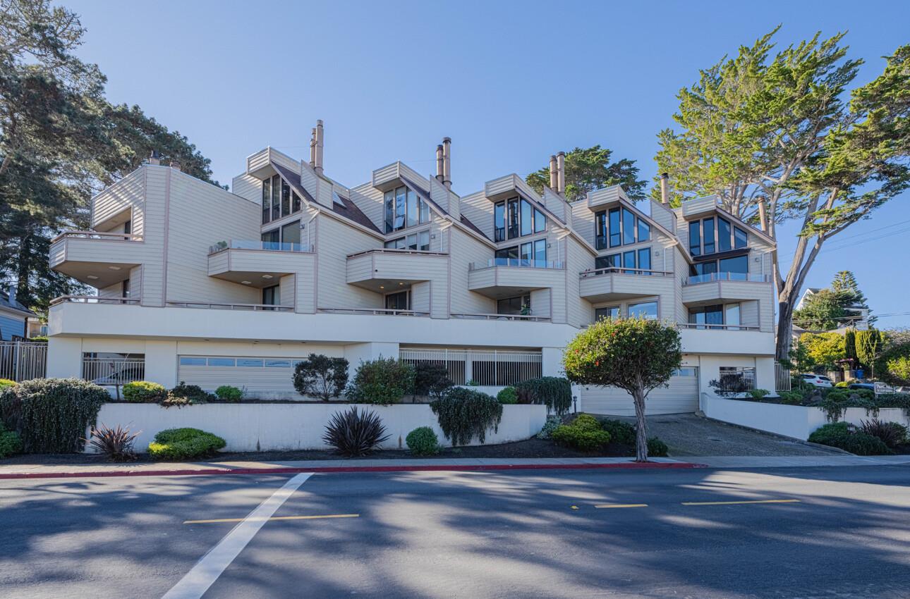 585 Hawthorne Street, Unit 103 Monterey, CA 93940 - Photo 2 of 30 a front view of a house with a tree