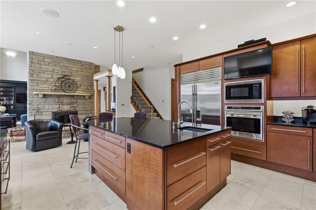 1653 Chapel Ridge Mars, PA 16046 - Photo 15 of 50 a kitchen with stainless steel appliances kitchen island granite countertop a stove and cabinets