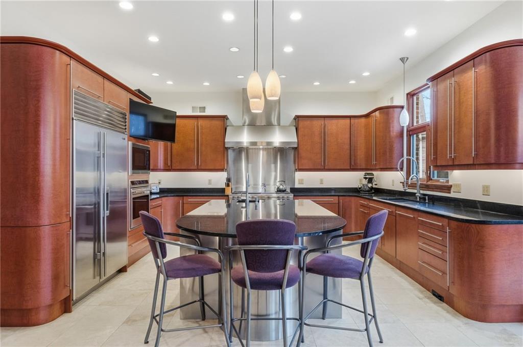 1653 Chapel Ridge Mars, PA 16046 - Photo 19 of 50 a kitchen with stainless steel appliances granite countertop a kitchen island hardwood floor and a sink