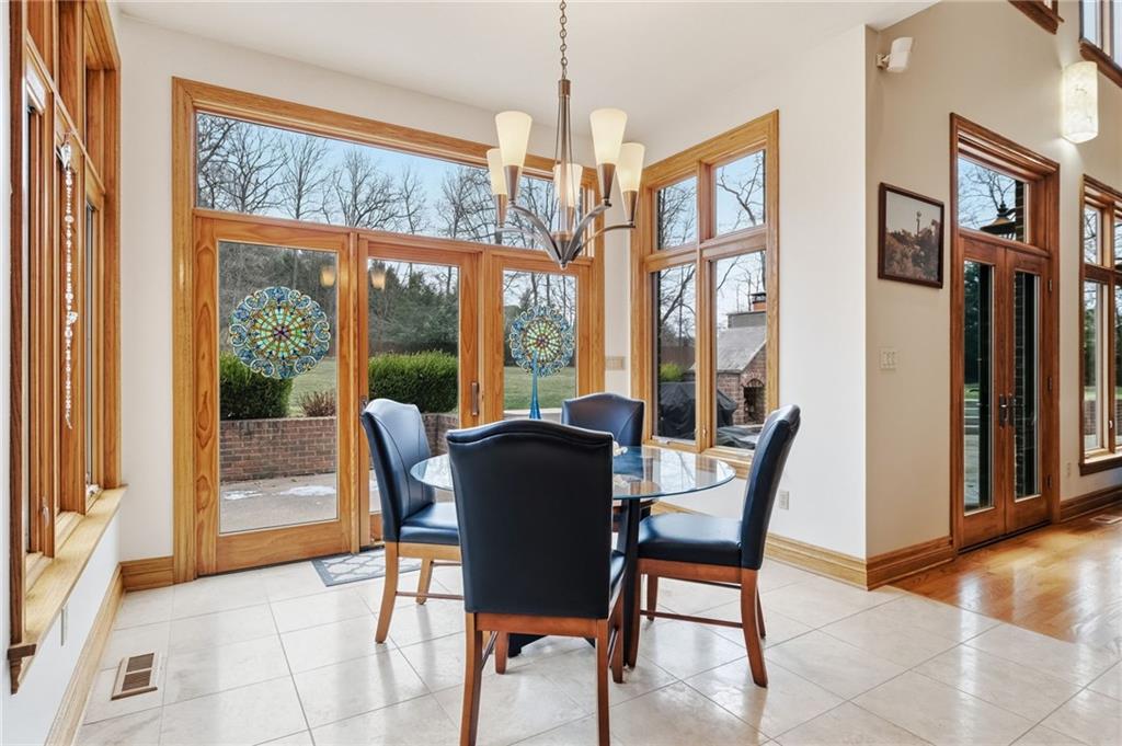 1653 Chapel Ridge Mars, PA 16046 - Photo 21 of 50 a dining room with furniture a chandelier and wooden floor