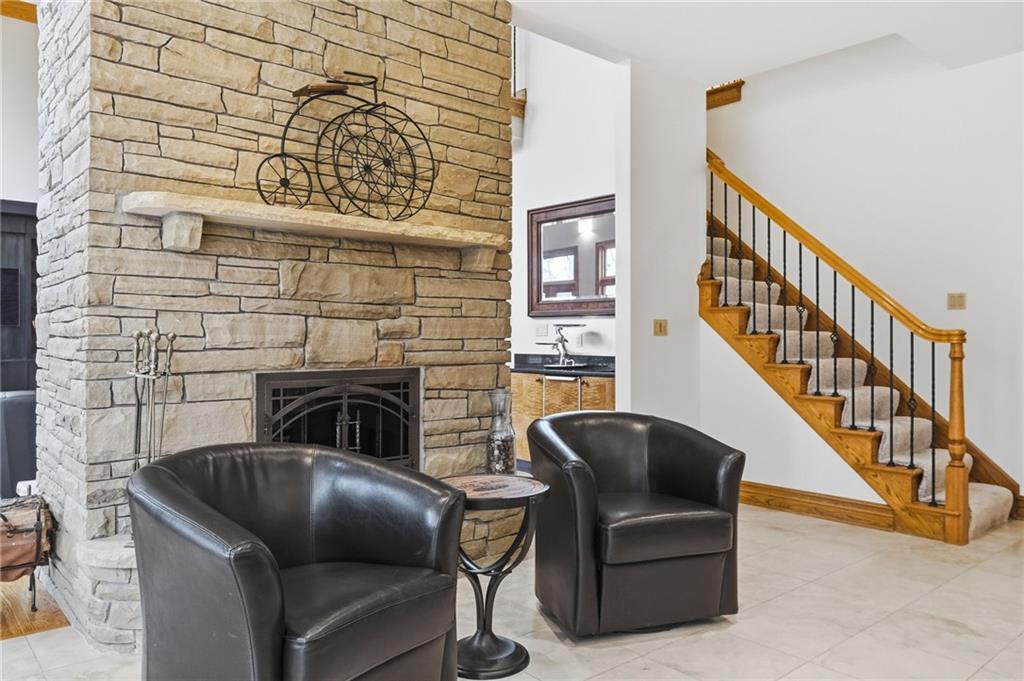 1653 Chapel Ridge Mars, PA 16046 - Photo 22 of 50 a living room with furniture and a fireplace