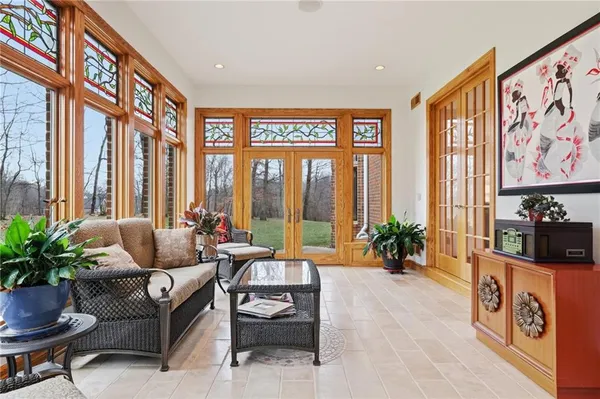 a living room with furniture and kitchen view