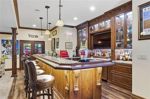 a large kitchen with stainless steel appliances granite countertop a sink and stove