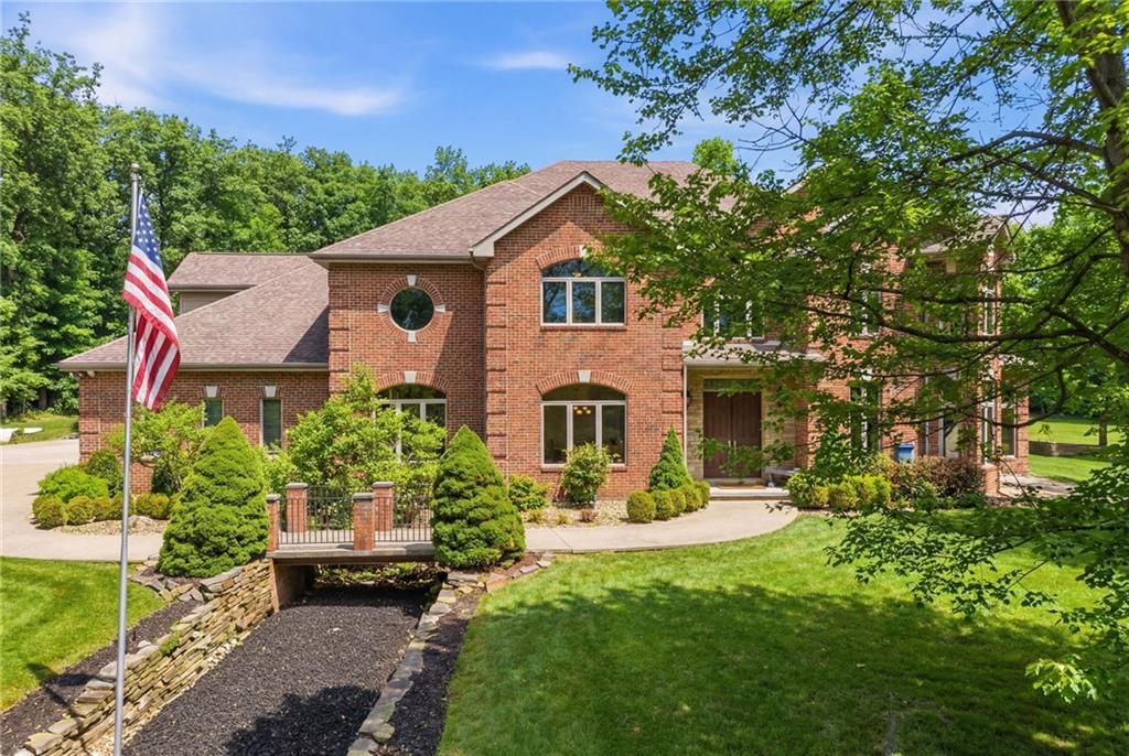 1653 Chapel Ridge Mars, PA 16046 - Photo 3 of 50 a front view of a house with a yard and potted plants