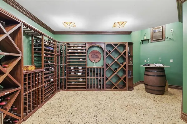 a bedroom with furniture and a large window