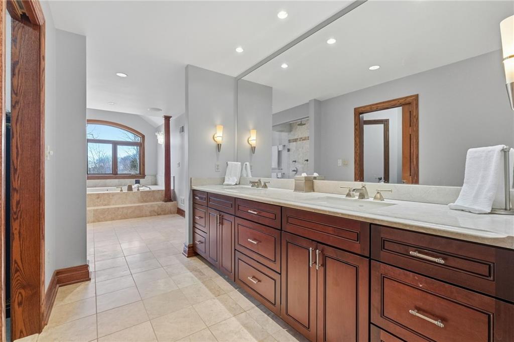 1653 Chapel Ridge Mars, PA 16046 - Photo 39 of 50 a spacious bathroom with a granite countertop sink mirror and cabinets