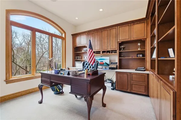 a dining room with furniture a chandelier and a rug