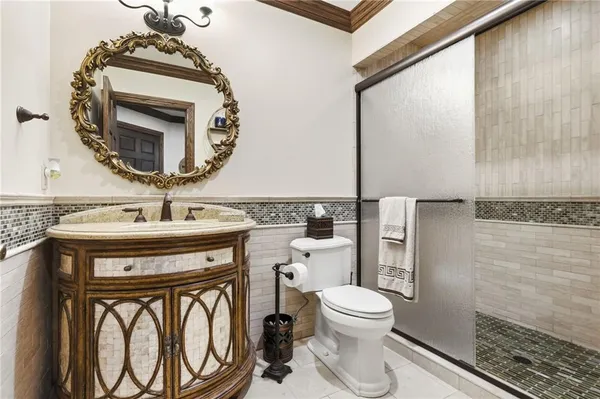 a bed room with furniture and a flat screen tv