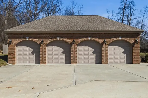 a large white building with a yard in front of it