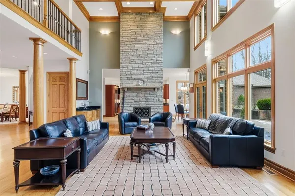 a living room with furniture and a floor to ceiling window