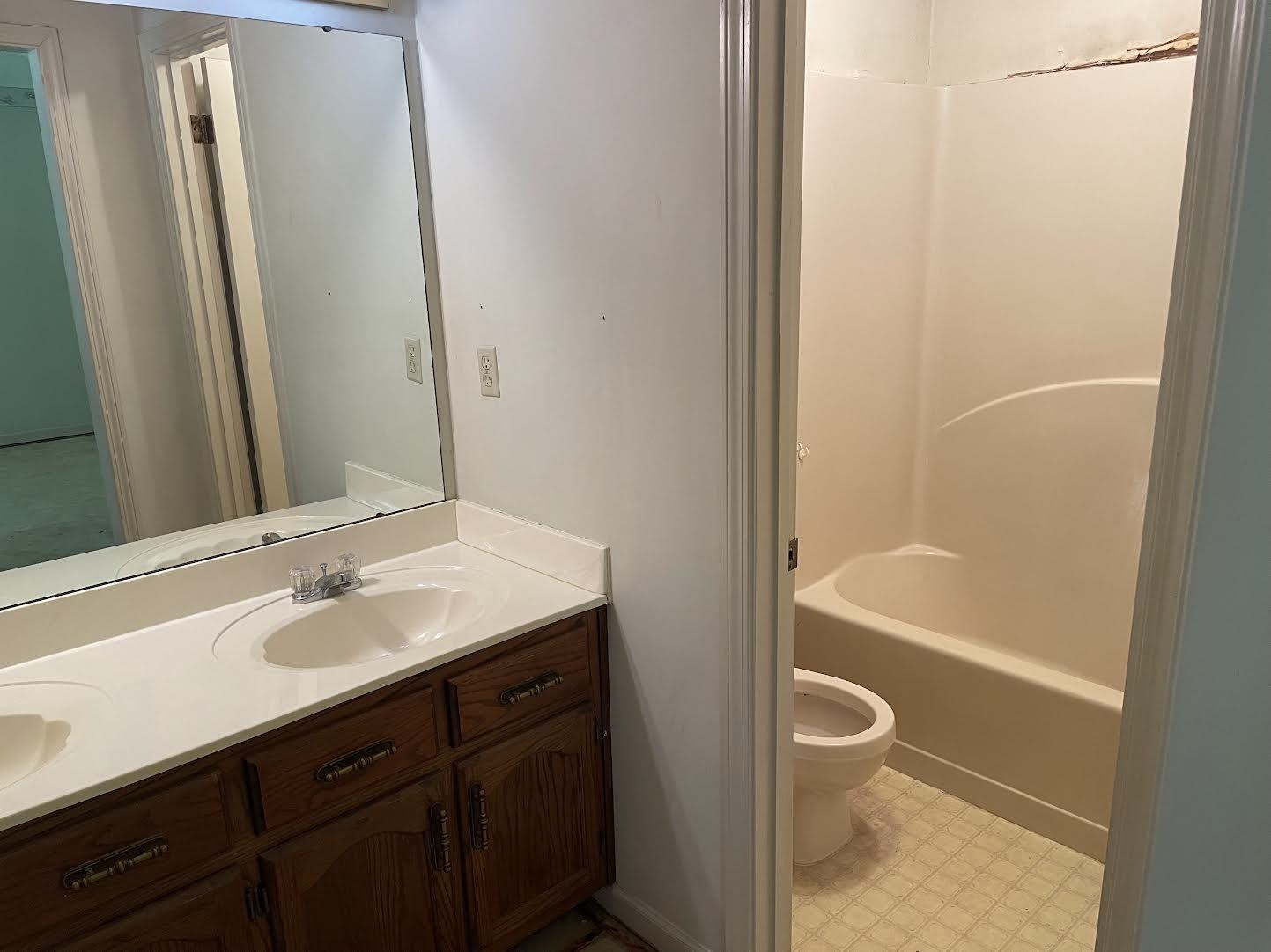 4713 Greenside Road Millington, TN 38053 - Photo 7 of 9 Full bathroom featuring tile floors, shower / washtub combination, toilet, and double sink vanity
