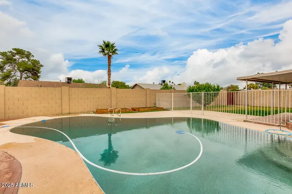 a view of a swimming pool with a lake view