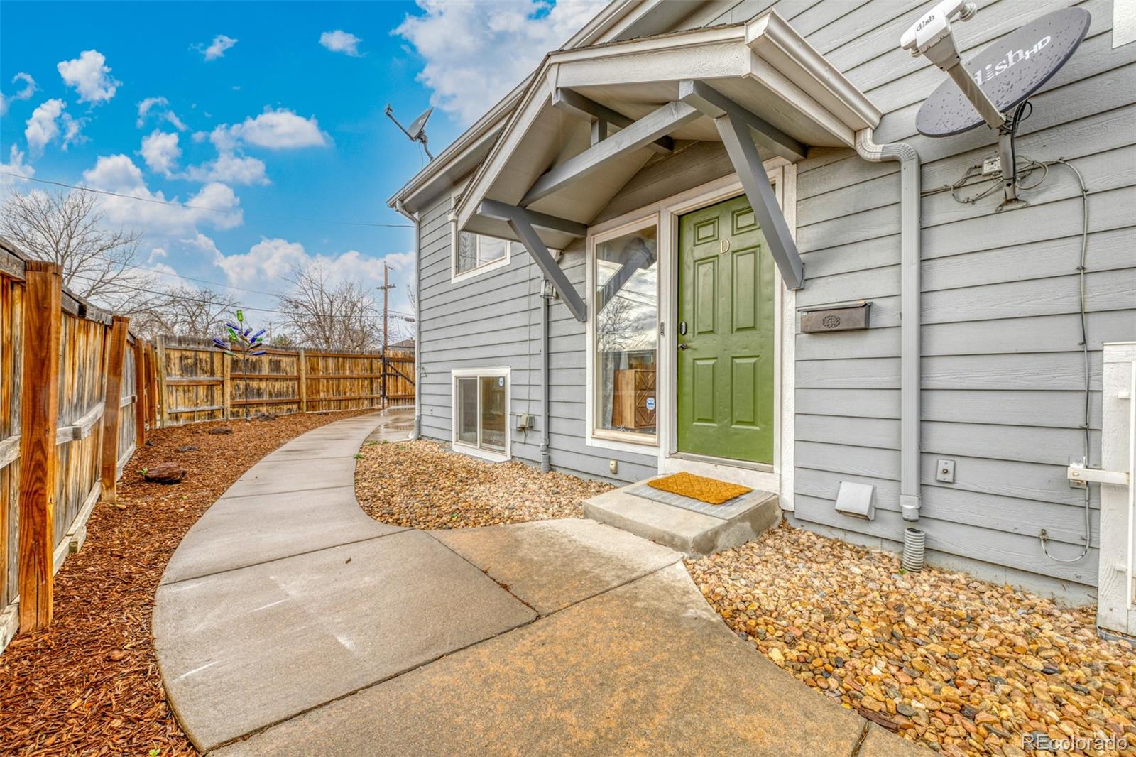 965 Wolff Street, Unit D Denver, CO 80204 - Photo 18 of 29 a view of a lounge chair in the back yard of a house