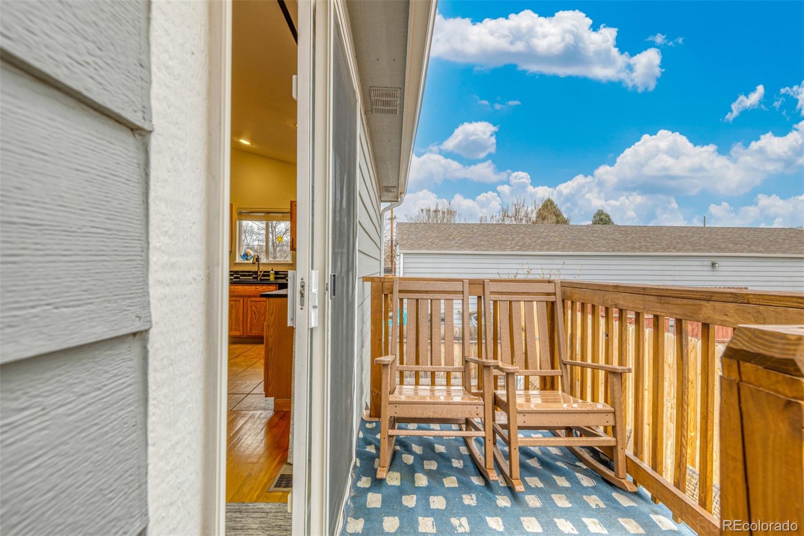 965 Wolff Street, Unit D Denver, CO 80204 - Photo 19 of 29 a view of a balcony with wooden floor