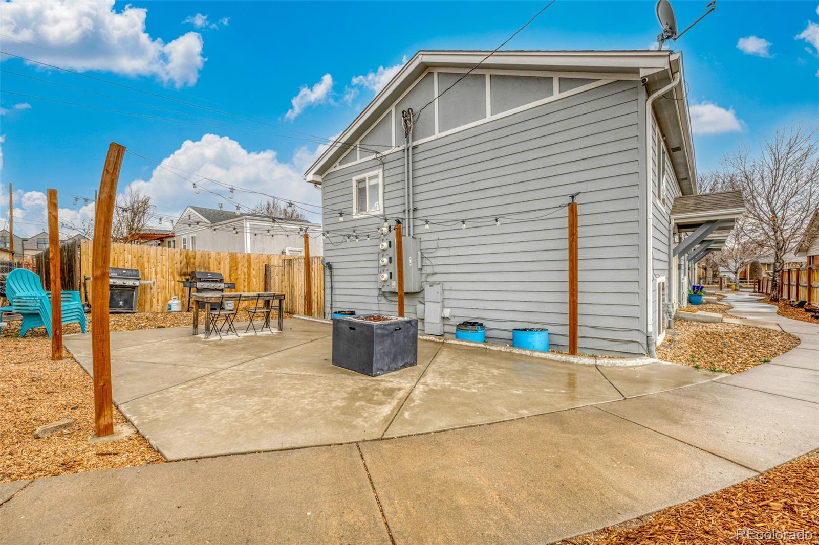 965 Wolff Street, Unit D Denver, CO 80204 - Photo 25 of 29 a view of a patio with a table and chairs