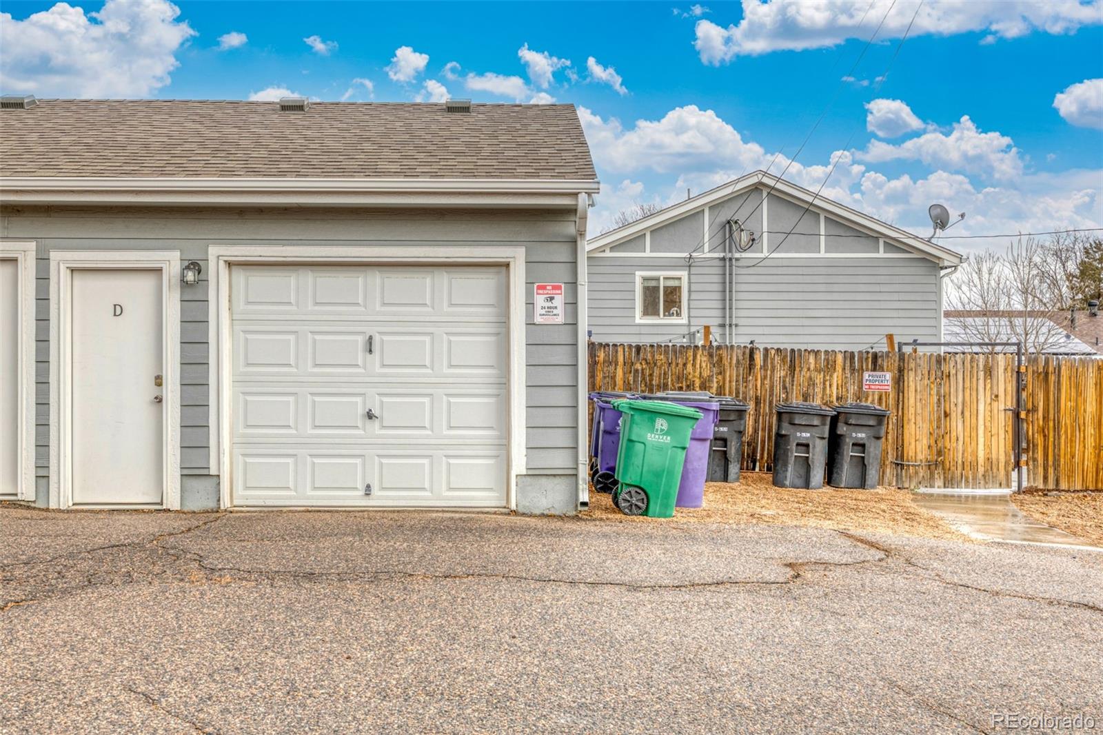 965 Wolff Street, Unit D Denver, CO 80204 - Photo 26 of 29 a front view of a house with a garage