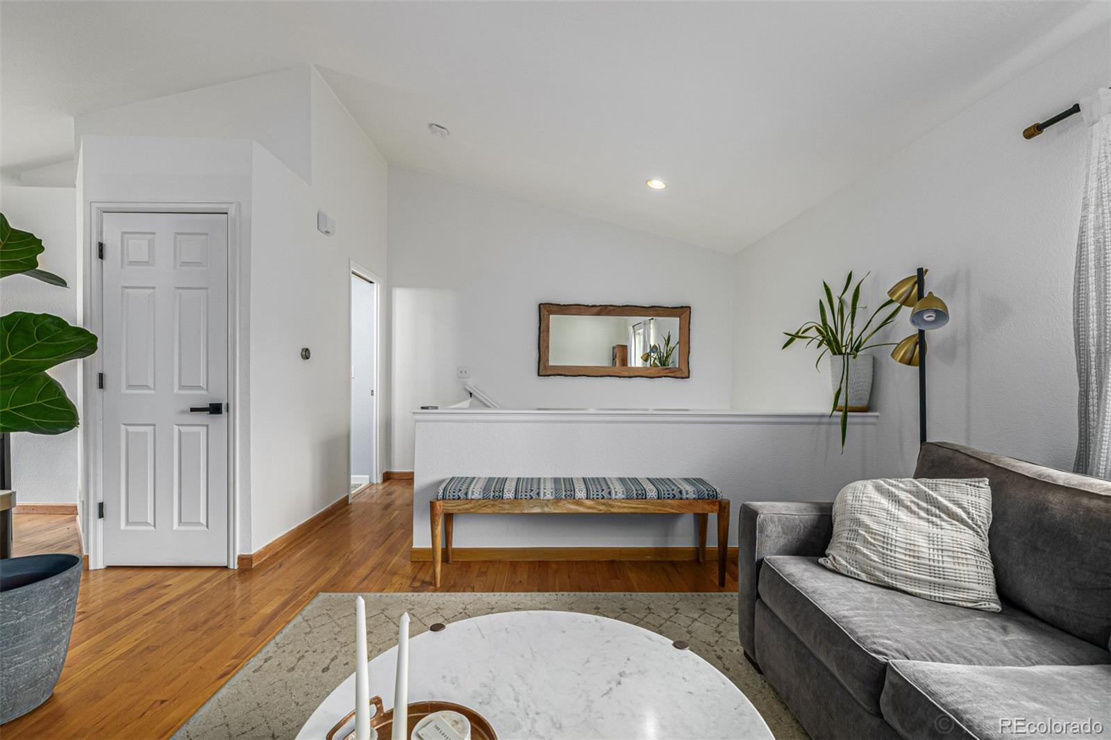 965 Wolff Street, Unit D Denver, CO 80204 - Photo 4 of 29 a living room with furniture and a wooden floor