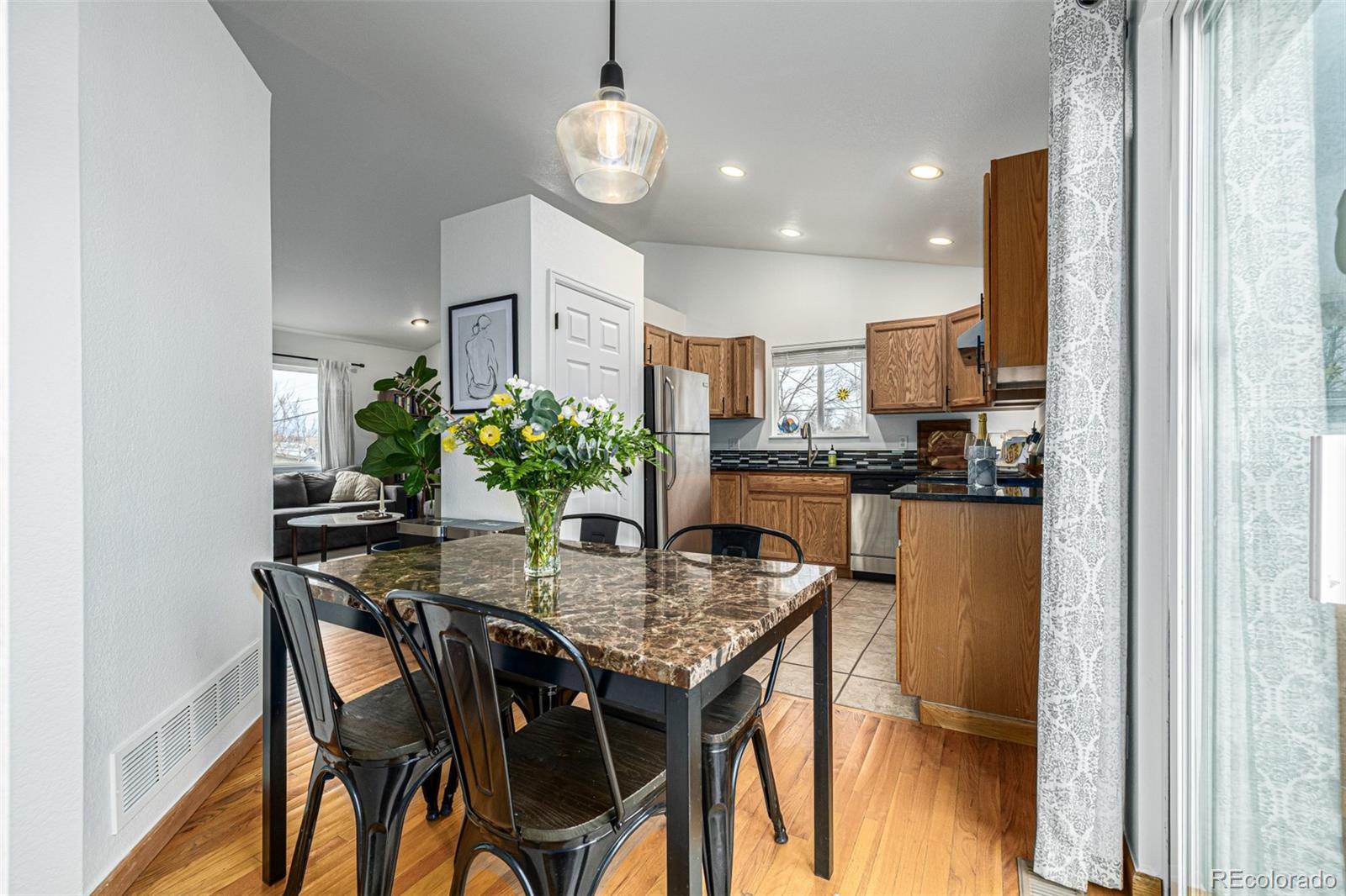 965 Wolff Street, Unit D Denver, CO 80204 - Photo 8 of 29 a view of a dining room with furniture