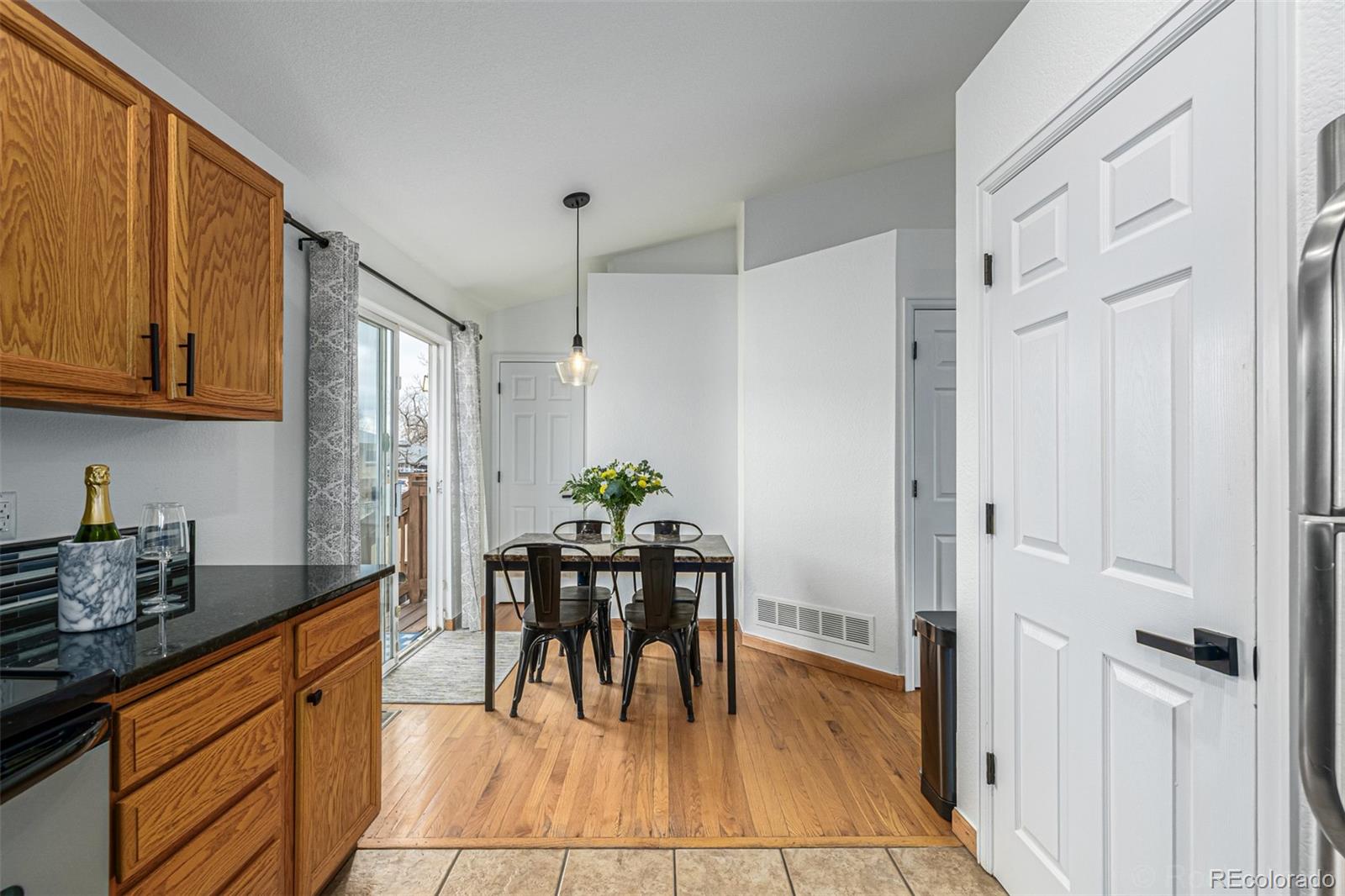 965 Wolff Street, Unit D Denver, CO 80204 - Photo 9 of 29 a view of dining table chairs and entryway