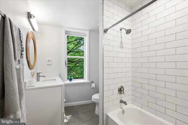 a bathroom with a sink a toilet and a bathtub