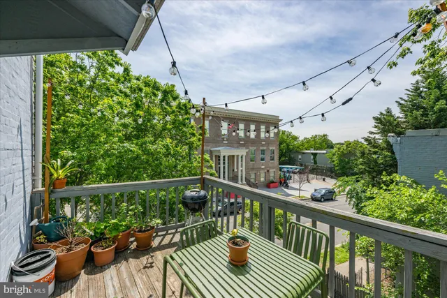 a view of a balcony with furniture