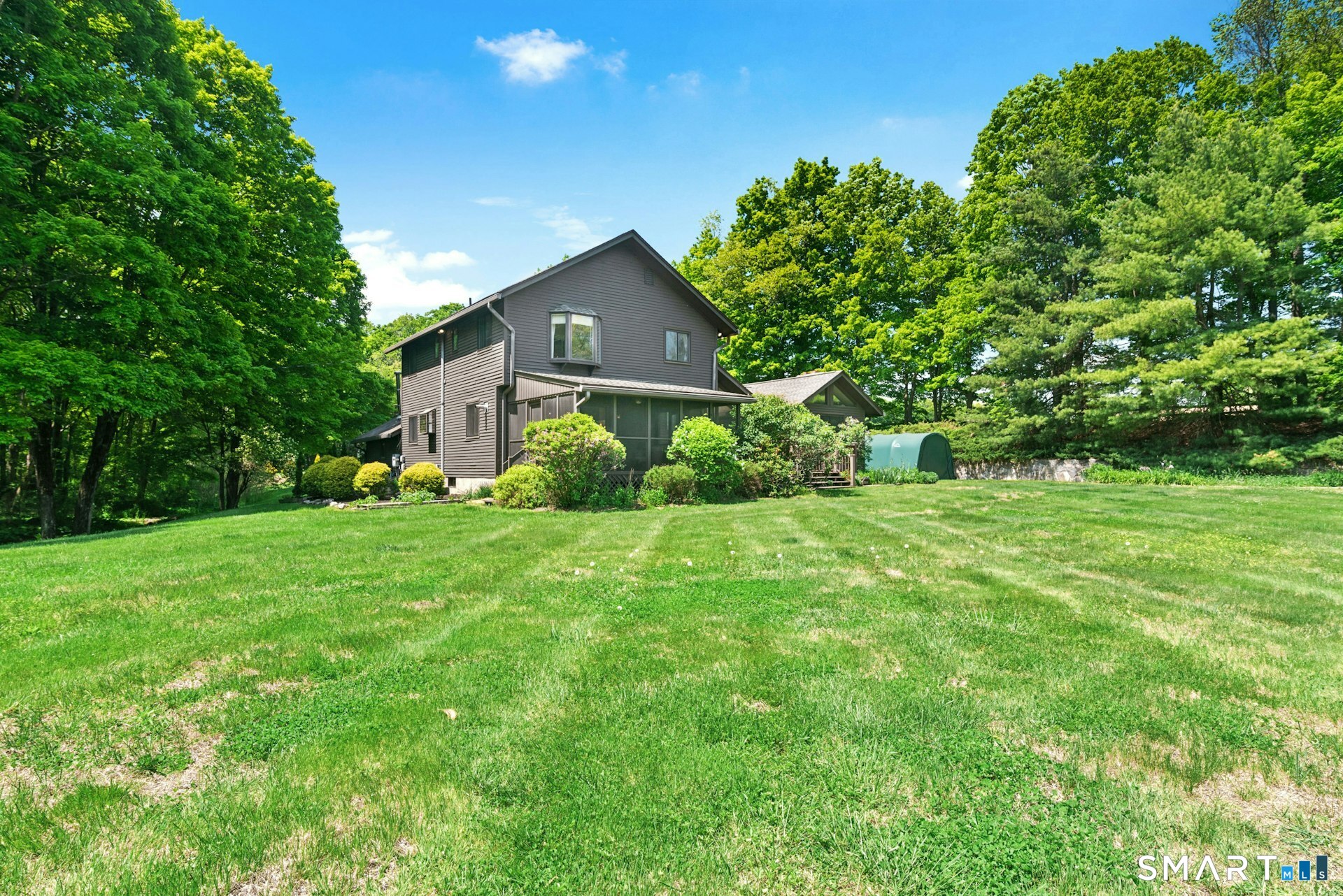 127 Huntingtown Road Newtown, CT 06470 - Photo 28 of 38 a front view of a house with garden